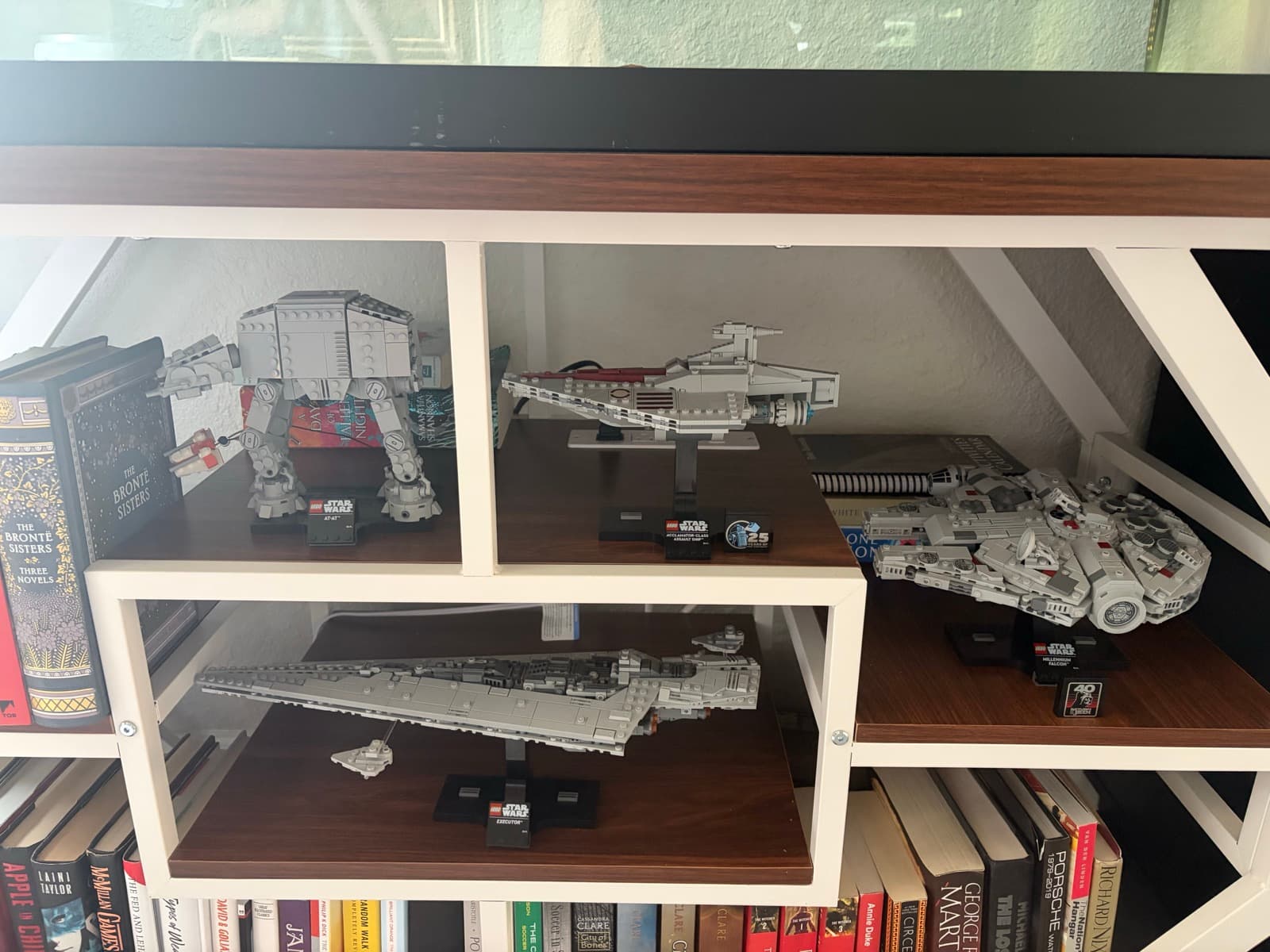 Shelf of midi-scale LEGO Star Wars ships: AT-AT, Acclamator, Executor, and Millennium Falcon