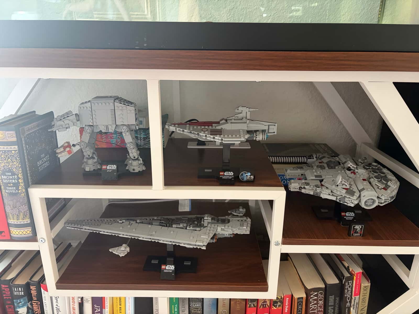 Shelf of midi-scale LEGO Star Wars ships: AT-AT, Acclamator, Executor, and Millennium Falcon